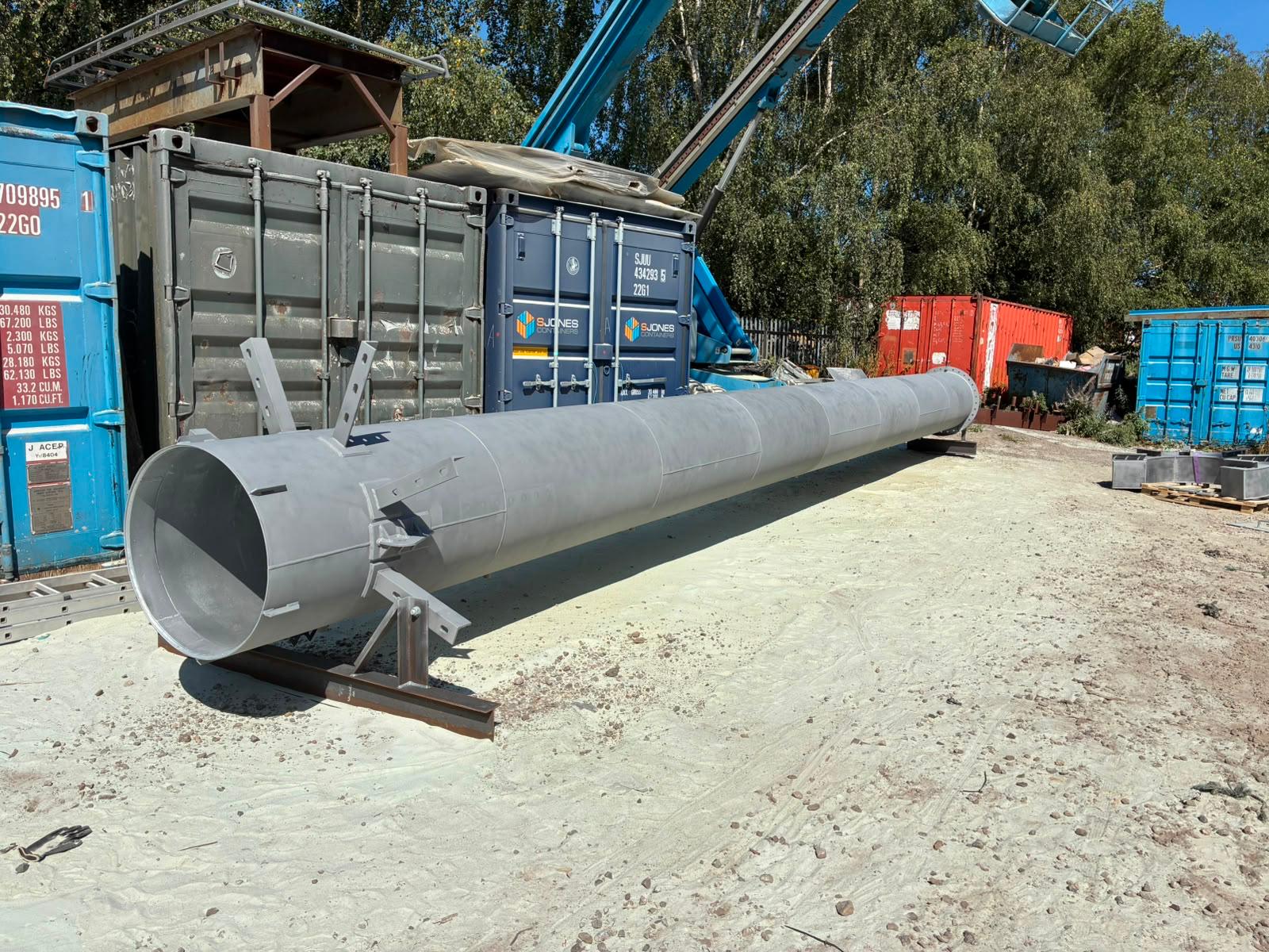 Commercial steel chimney after shot blasting — clean prepared fabricated steel finish