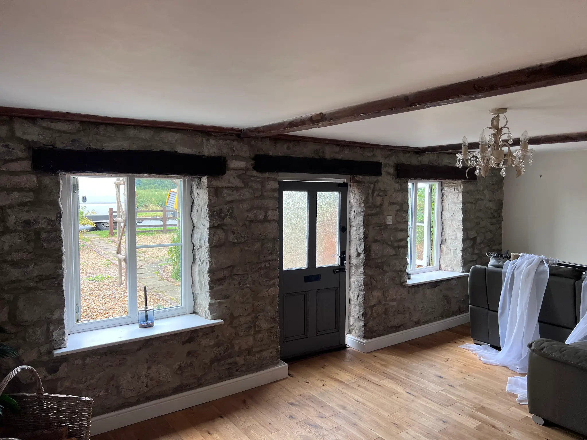 Dark-coated interior timber beams before restoration — Northampton Sandblasting